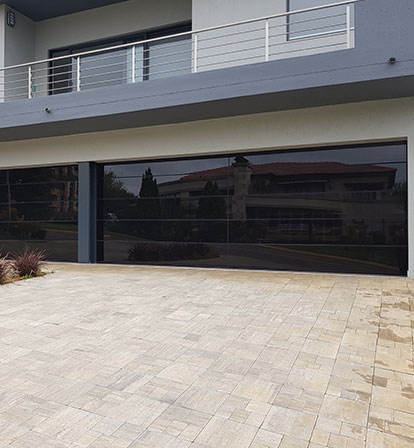 Black glass panel garage door 16x7